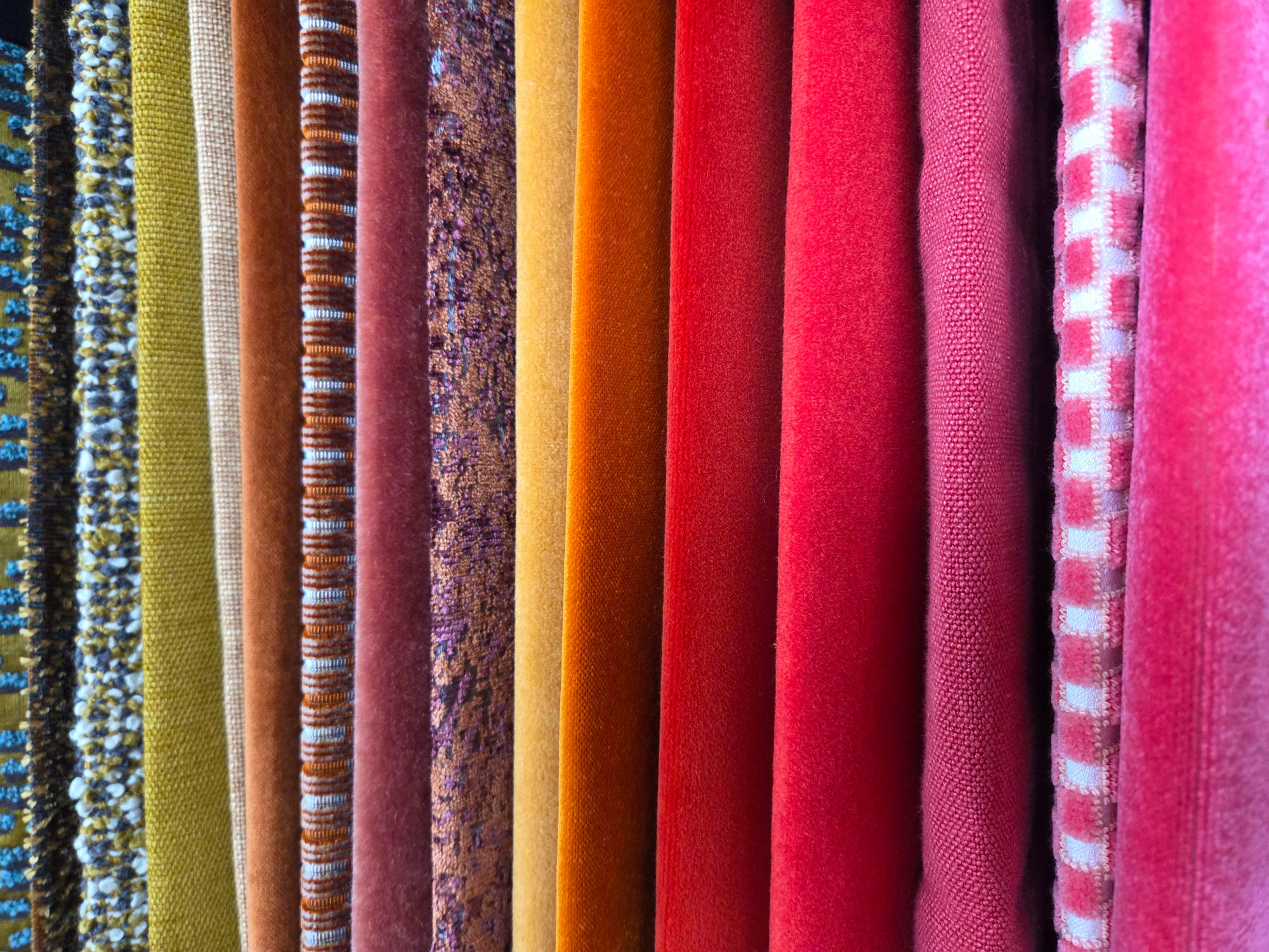 Designer fabrics with a color gradient from pink through yellow to green – sustainable deadstock meterware for sewing & upcycling.